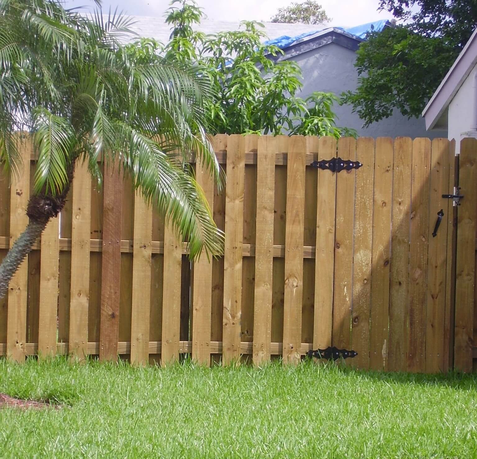 A wood fence and gate installed in a home in Plantation, FL