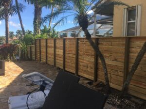Horizontal wood fence beside a residential patio by Andes Fence